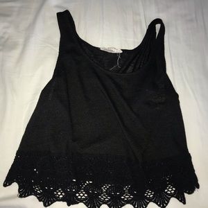 Black tank top with floral prints on the bottom